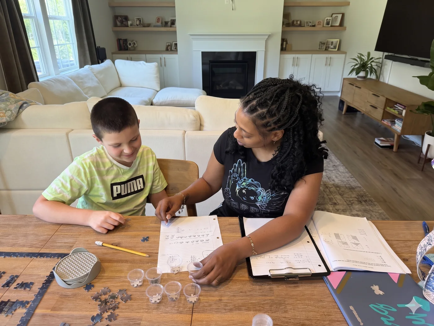 Tutor helping a fourth grade student with math at home